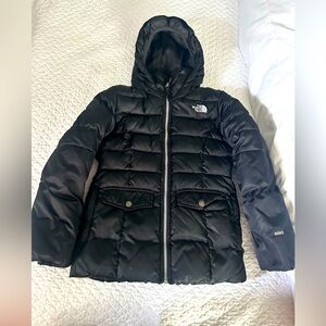 Northface black puffer with attached hood and cinch waist. Girls size medium.